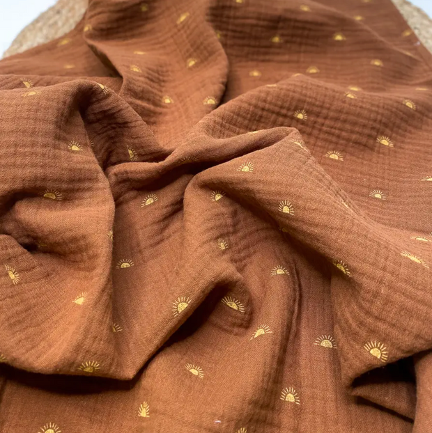 rust sunshine · organic cotton swaddle blanket